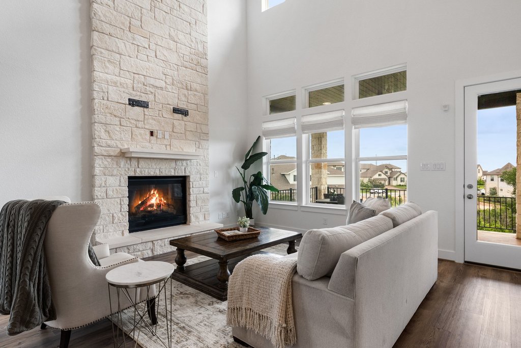 305 Avena Trail Austin, TX 78738 - Photo 23 of 40 a living room with furniture and a fireplace