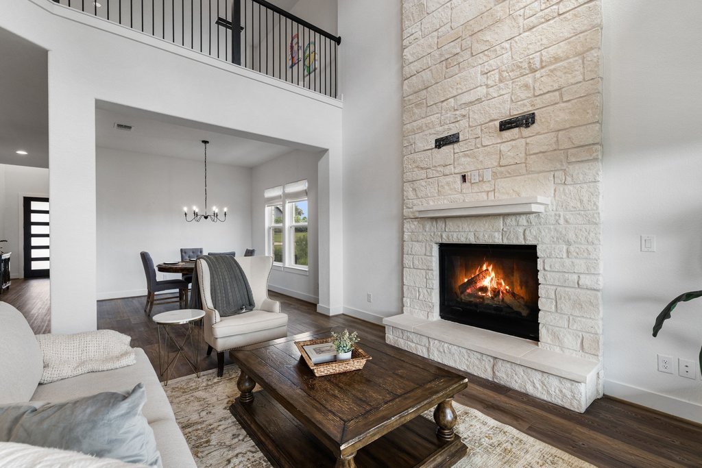 305 Avena Trail Austin, TX 78738 - Photo 25 of 40 a living room with furniture and a fireplace