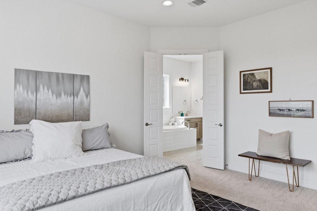 305 Avena Trail Austin, TX 78738 - Photo 26 of 40 Primary bedroom with recessed lighting, and an ensuite bathroom.