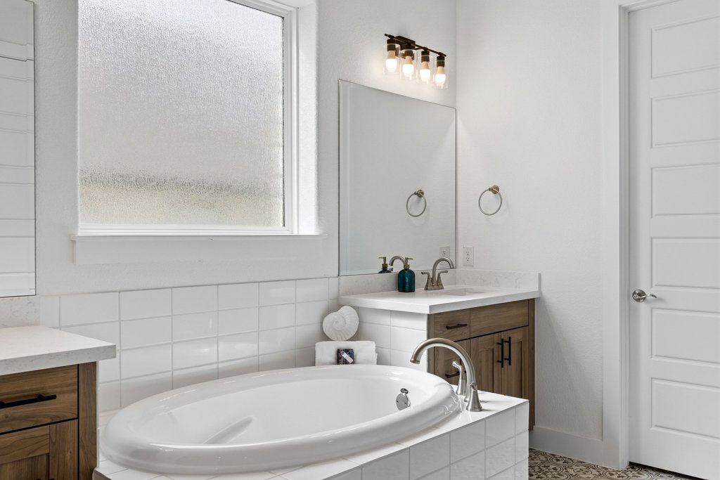 305 Avena Trail Austin, TX 78738 - Photo 27 of 40 a bathroom with a bathtub and sink