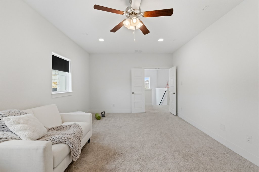 305 Avena Trail Austin, TX 78738 - Photo 30 of 40 a living room with furniture and a ceiling fan