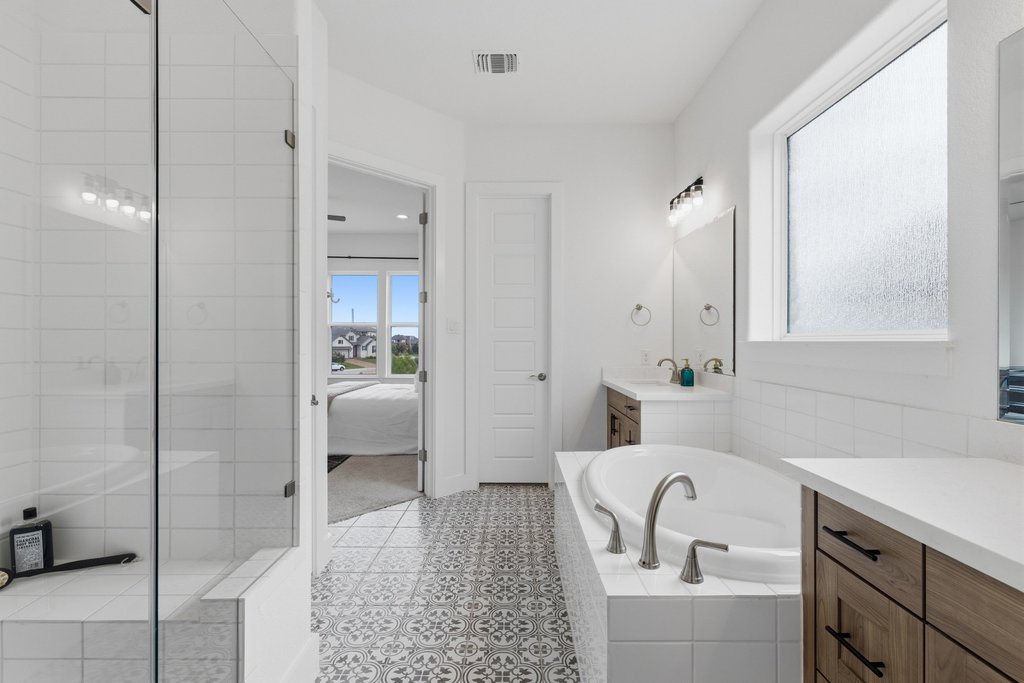 305 Avena Trail Austin, TX 78738 - Photo 8 of 40 a bathroom with a sink a toilet and shower