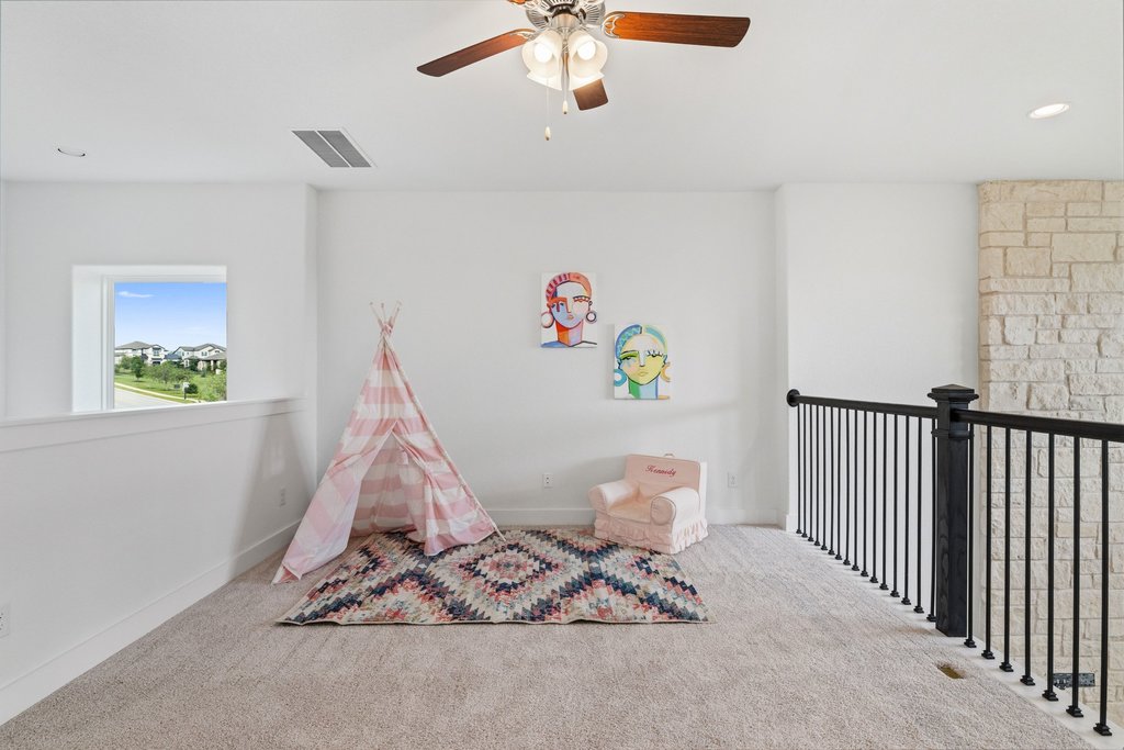 305 Avena Trail Austin, TX 78738 - Photo 10 of 40 Upstairs spacious game room great for a kid space or second living area for entertaining.