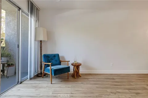 a view of a workspace with furniture and a table