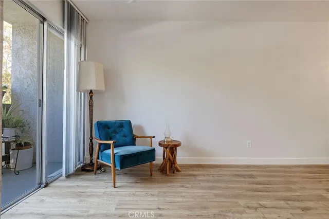 a view of a workspace with furniture and a table