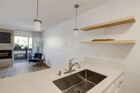 a stove top oven sitting inside of a kitchen
