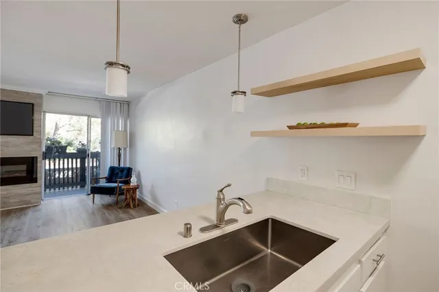 a stove top oven sitting inside of a kitchen