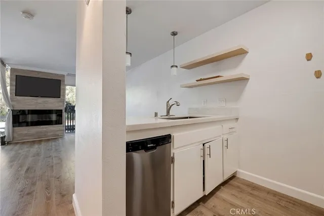 a kitchen with a refrigerator and a sink