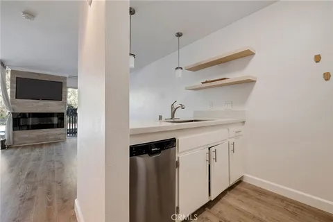 a kitchen with a refrigerator and a sink