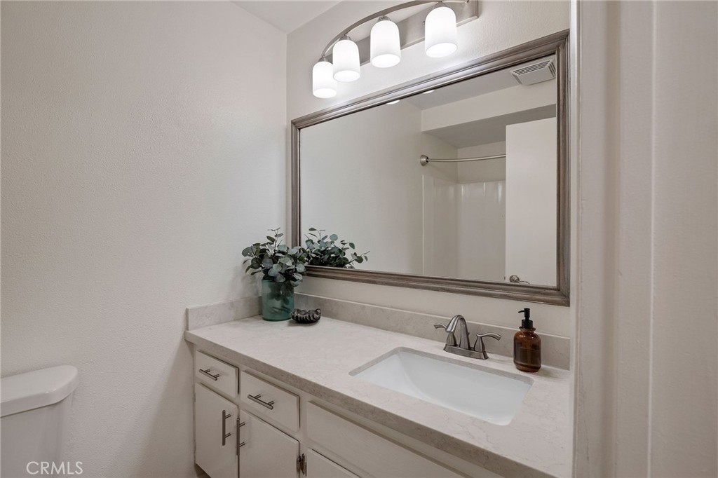 3604 West Estates Lane, Unit 114 Rolling Hills Estates, CA 90274 - Photo 23 of 59 a bathroom with a sink and a toilet