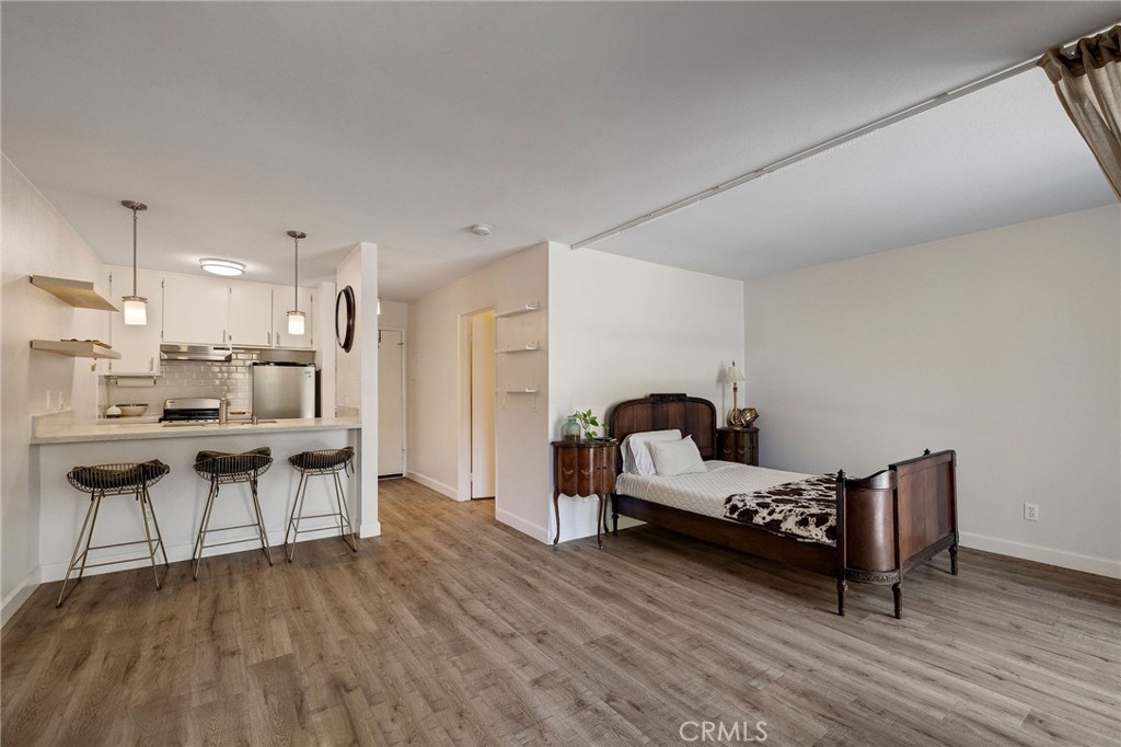 3604 West Estates Lane, Unit 114 Rolling Hills Estates, CA 90274 - Photo 3 of 59 a living room with furniture and kitchen view