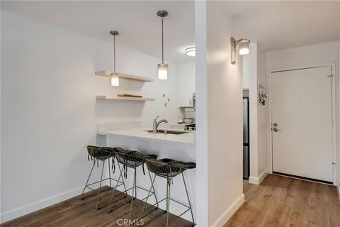 a view of a dining room and wooden floor