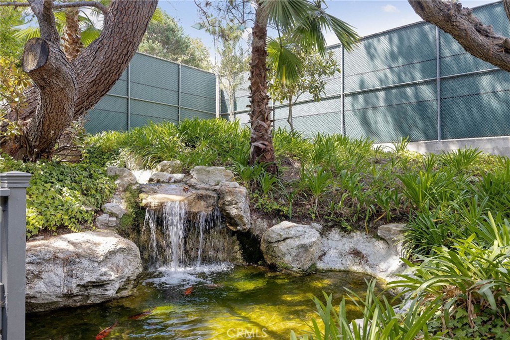 3604 West Estates Lane, Unit 114 Rolling Hills Estates, CA 90274 - Photo 43 of 59 a backyard of a house with swimming pool and plants