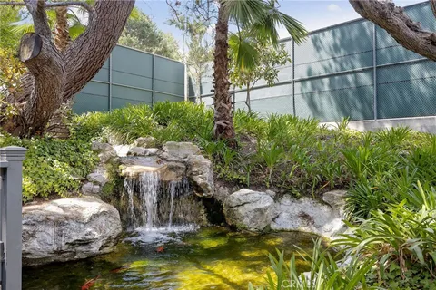 a room with pool table and windows
