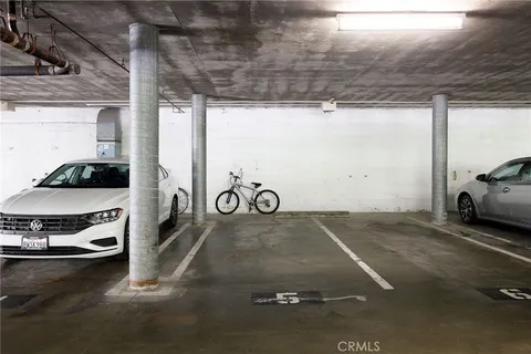 a view of a house with a yard and potted plants
