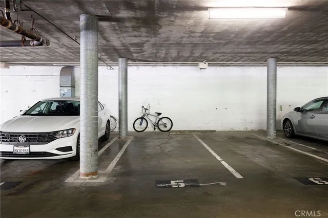 a front view of a building with a garden