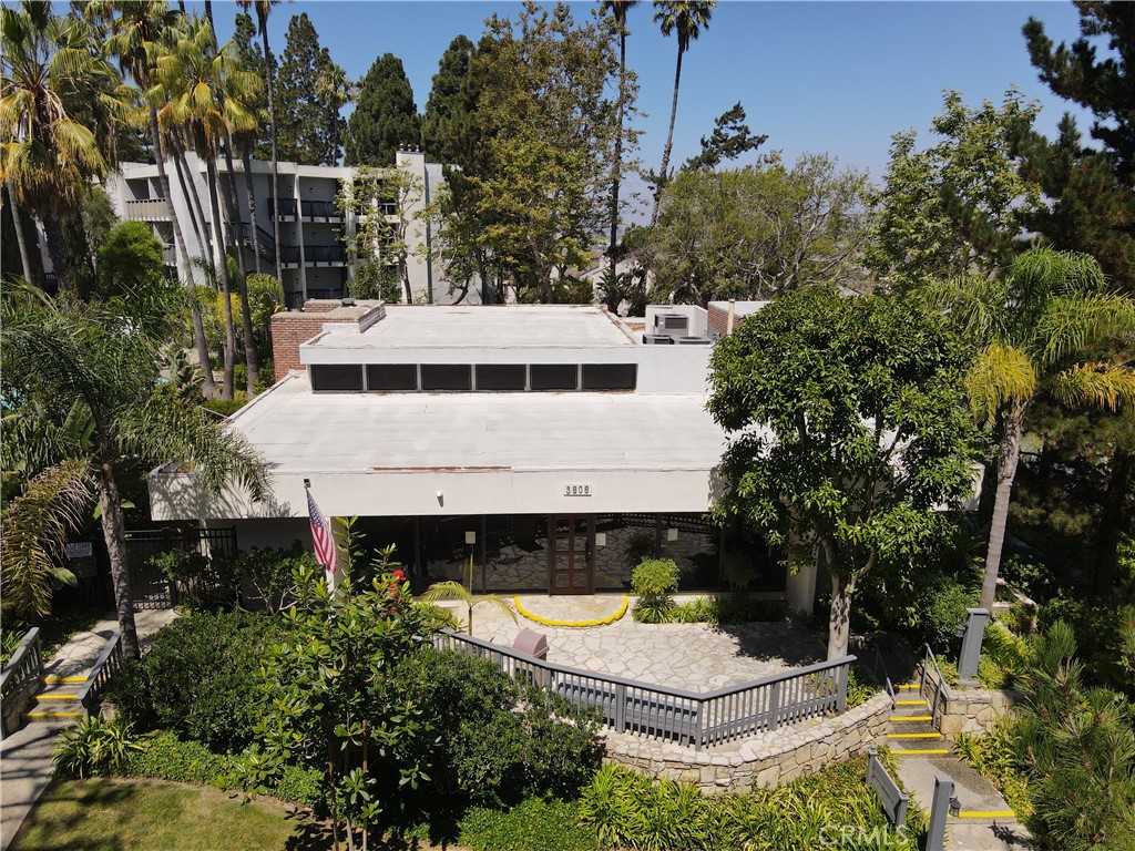 3604 West Estates Lane, Unit 114 Rolling Hills Estates, CA 90274 - Photo 54 of 59 a view of house with swimming pool and trees in the background