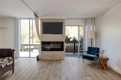 a room with furniture and wooden floor