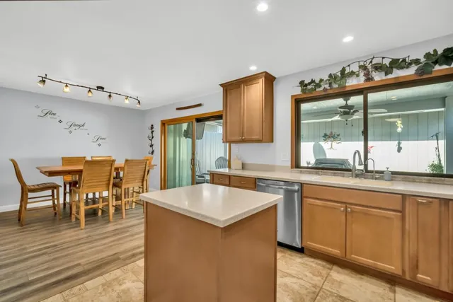 a large kitchen with a table and chairs in it