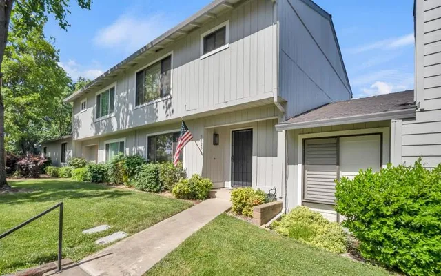 a front view of a house with a yard