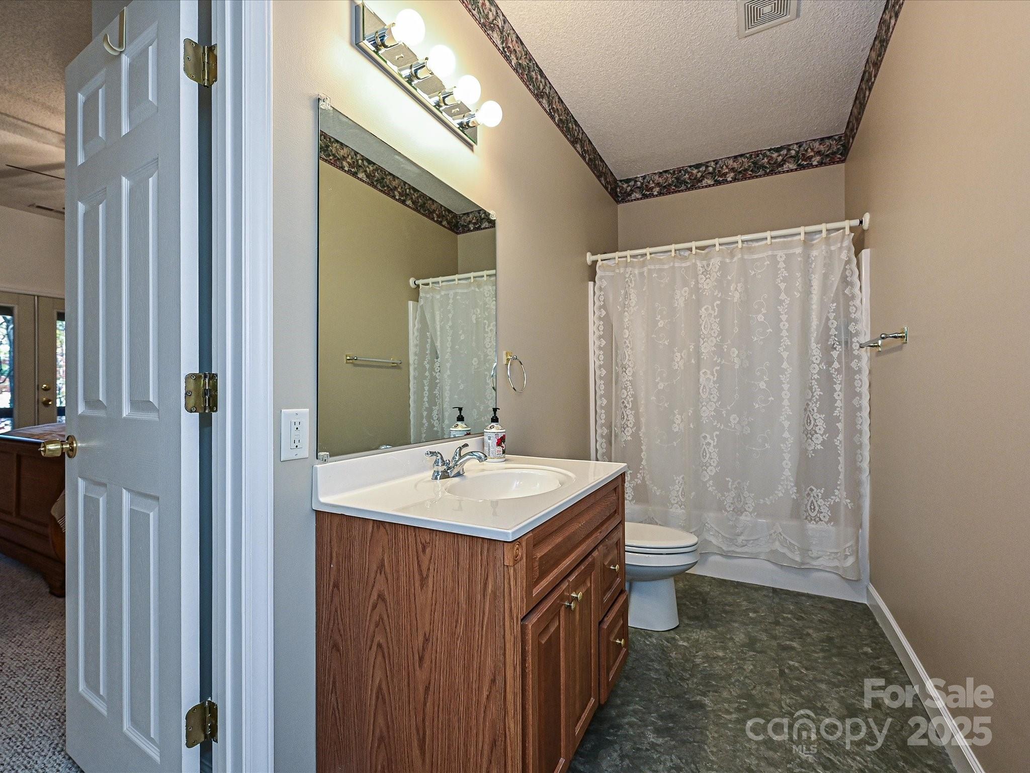25040 Timberlake Drive Tega Cay, SC 29708 - Photo 32 of 40 a bathroom with a sink toilet and shower