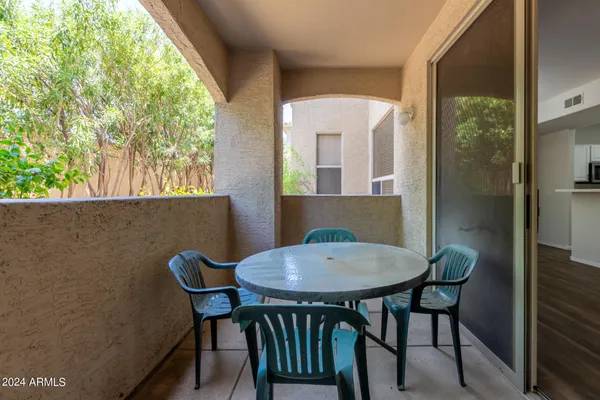 a view of a dining room with furniture and window