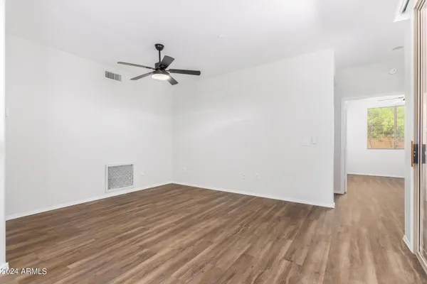 a view of a kitchen from the hallway