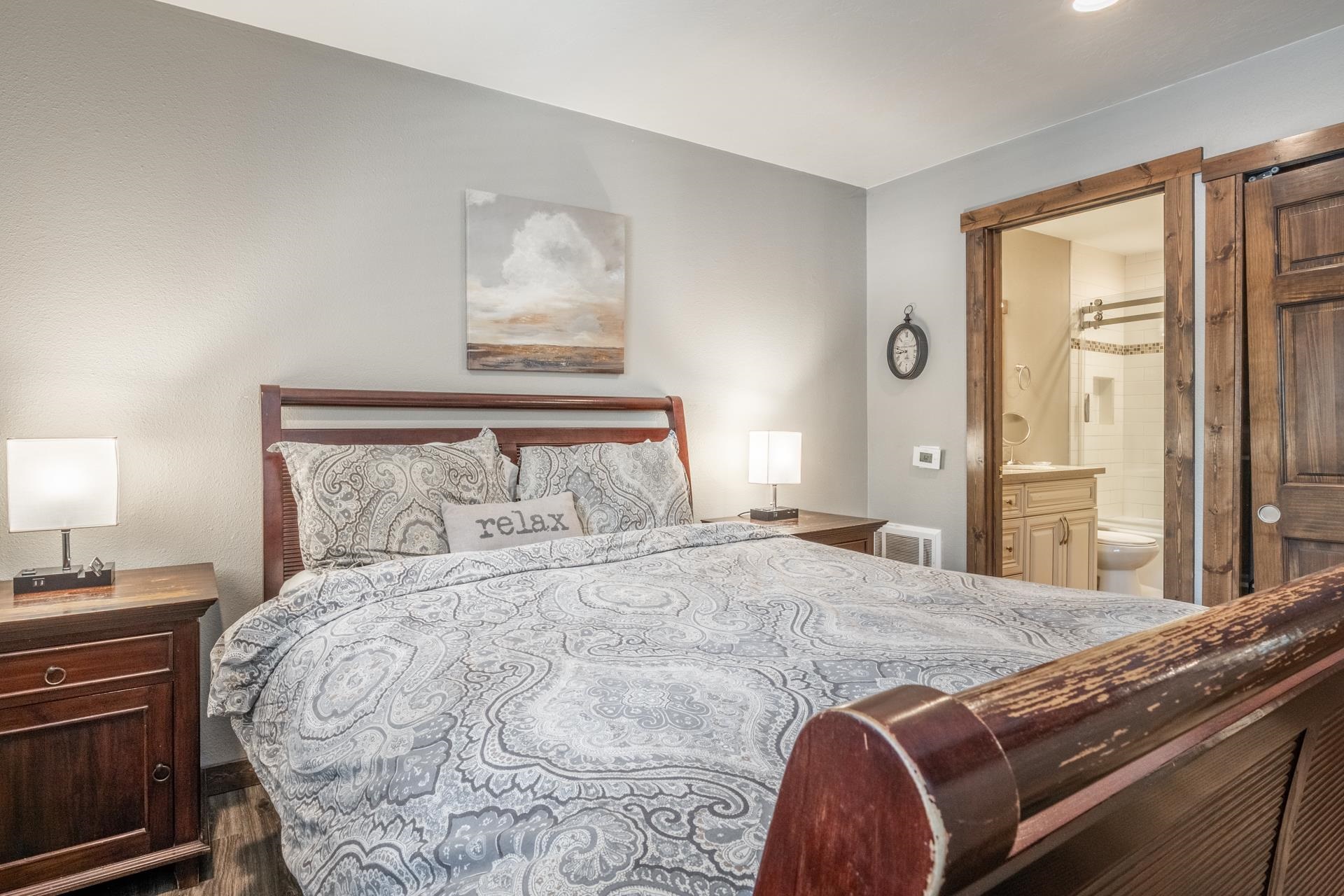2499 Sierra Nevada Road, Unit S1 Mammoth Lakes, CA 93546 - Photo 21 of 38 Bedroom featuring connected bathroom and dark wood-style floors