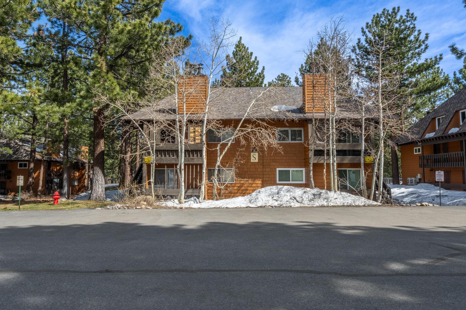 2499 Sierra Nevada Road, Unit S1 Mammoth Lakes, CA 93546 - Photo 24 of 38 View of front of home with a chimney and a balcony