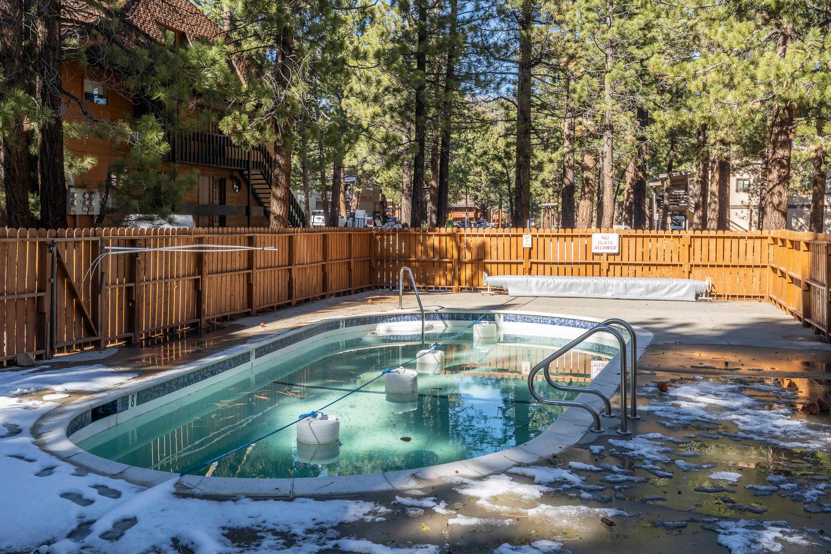 2499 Sierra Nevada Road, Unit S1 Mammoth Lakes, CA 93546 - Photo 29 of 38 View of pool featuring a fenced backyard, patio surround, and a hot tub