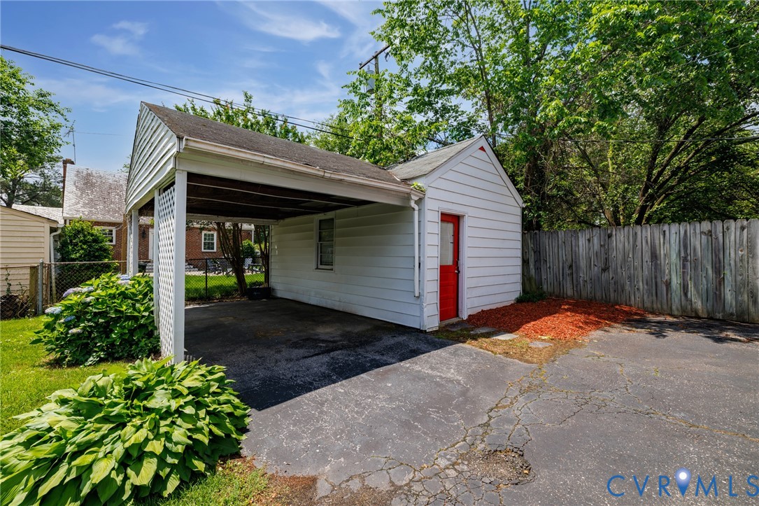 2405 Dumbarton Road Henrico, VA 23228 - Photo 25 of 34 Carport with white siding, exterior storage shed w