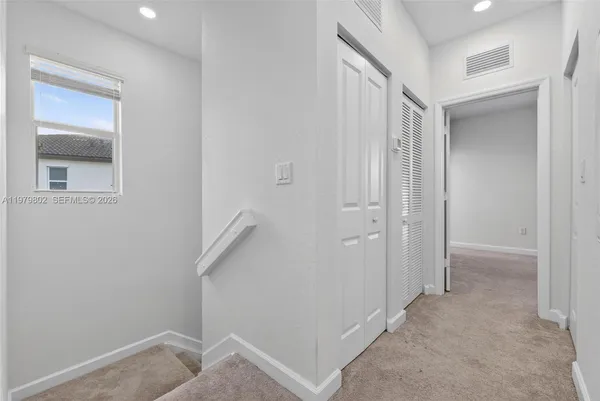 a view of hallway with closet