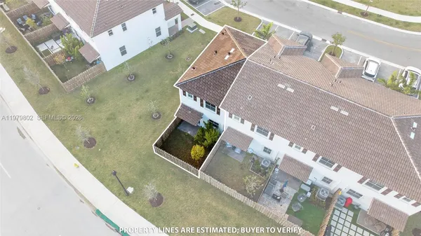 a view of a house with pool and chairs
