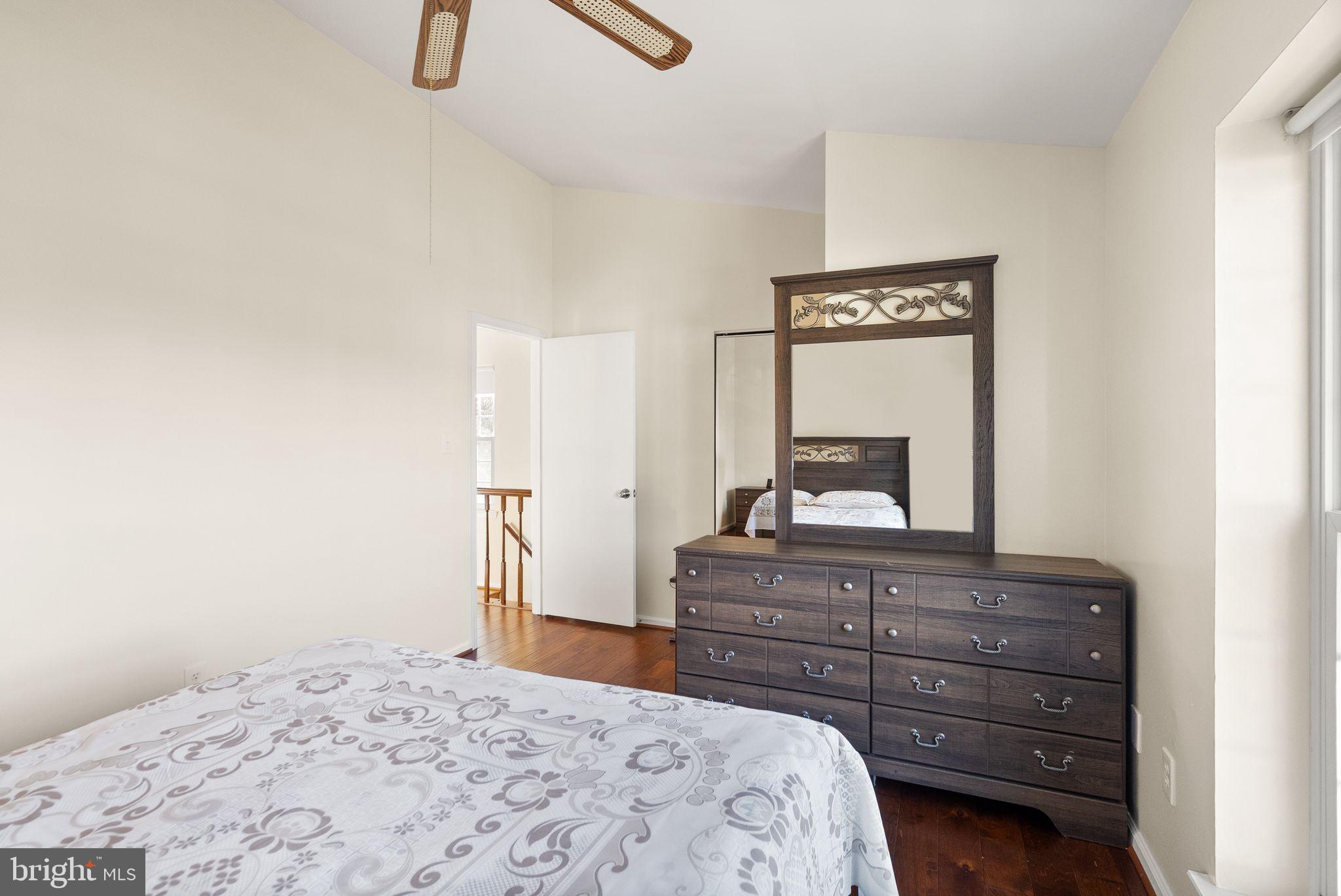 346 Lancaster Square Sterling, VA 20164 - Photo 12 of 24 a bedroom with a bed and a dresser