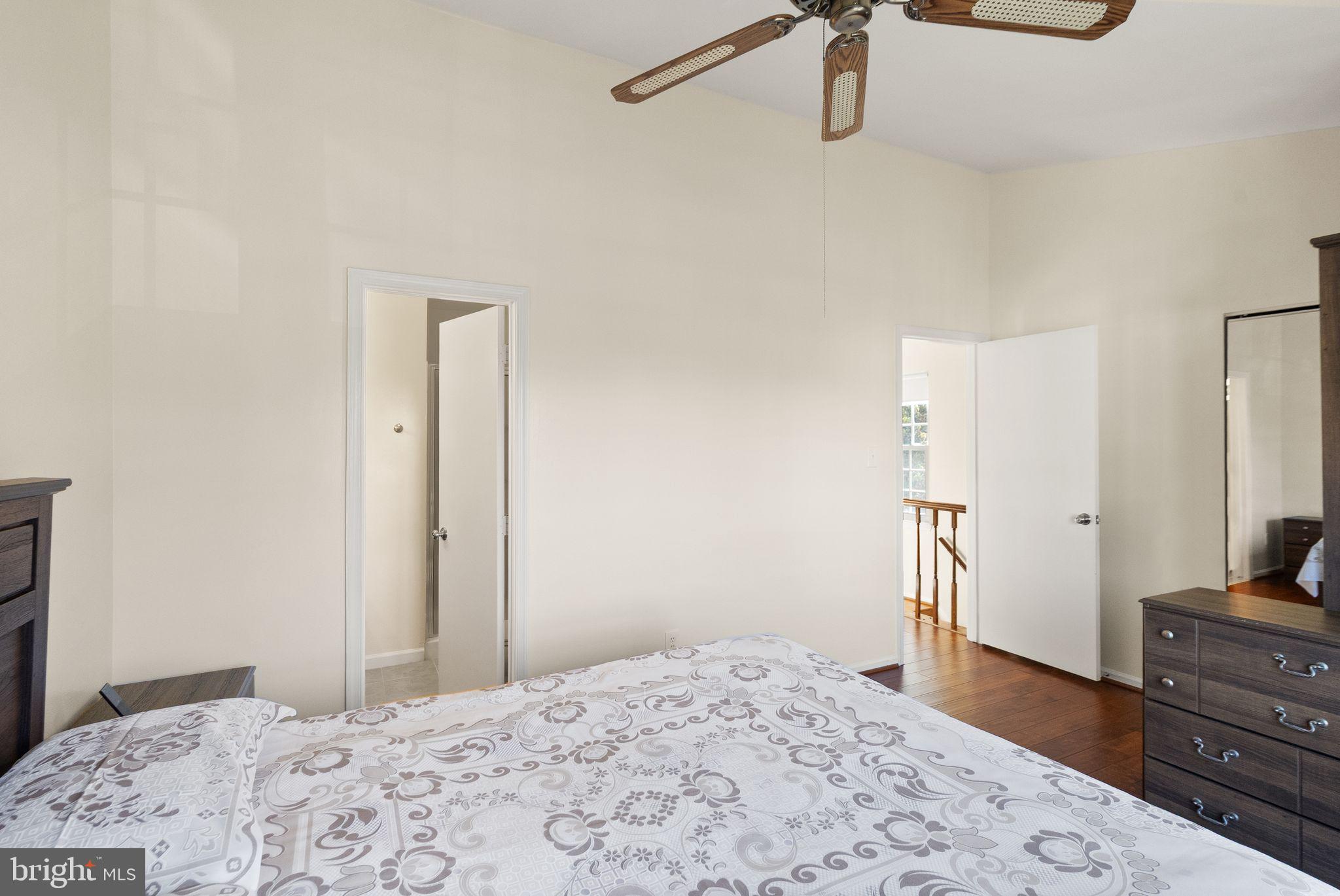 346 Lancaster Square Sterling, VA 20164 - Photo 13 of 24 a bedroom with a bed and a dresser in it