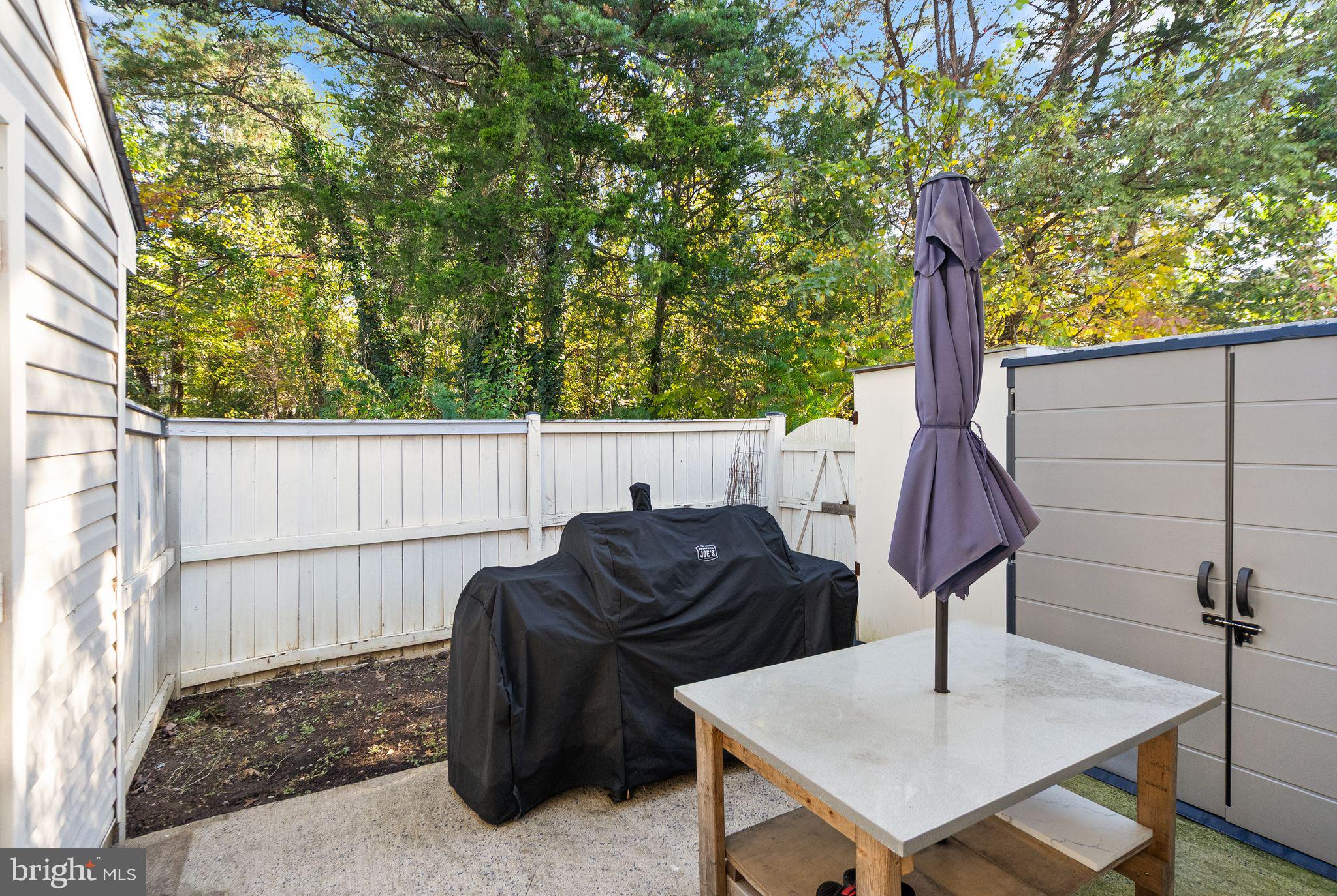 346 Lancaster Square Sterling, VA 20164 - Photo 15 of 24 a backyard of a house with table and chairs