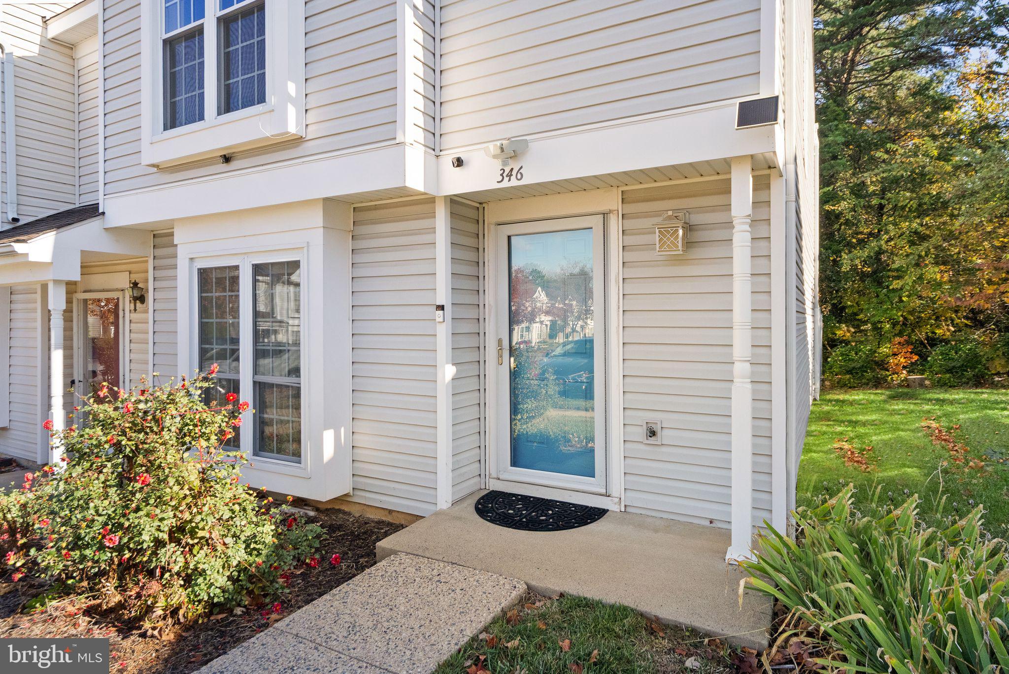 346 Lancaster Square Sterling, VA 20164 - Photo 20 of 24 a front view of a house with garden