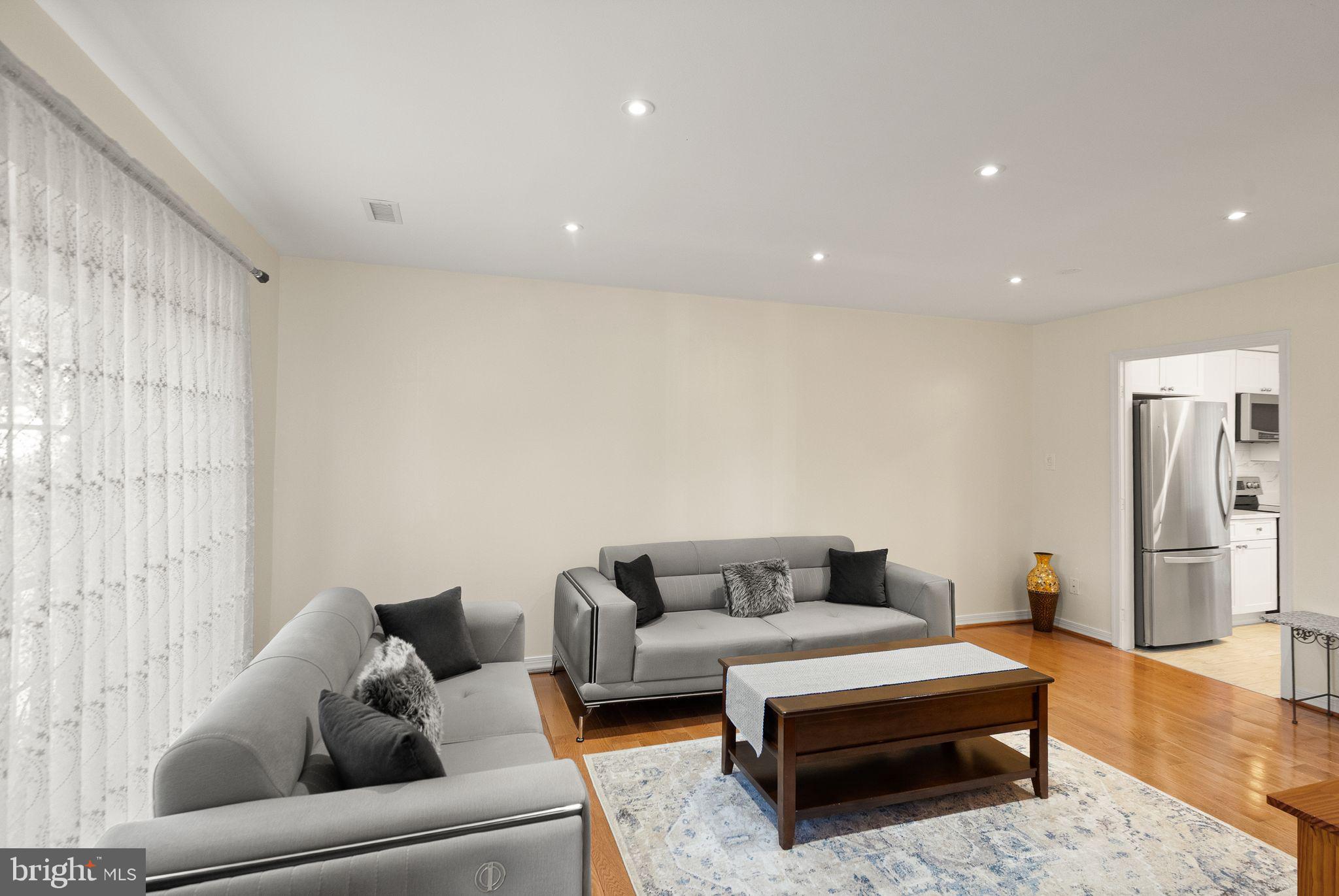346 Lancaster Square Sterling, VA 20164 - Photo 7 of 24 a living room with furniture and a rug
