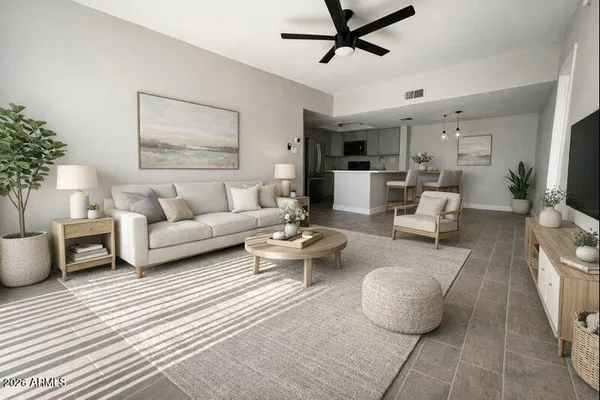 a living room with furniture and a rug