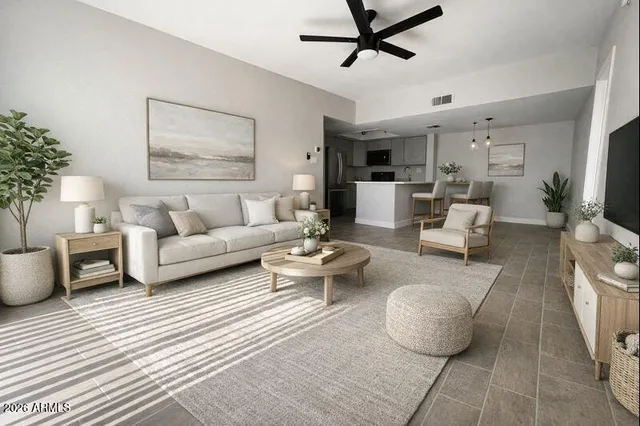 a living room with furniture and a rug