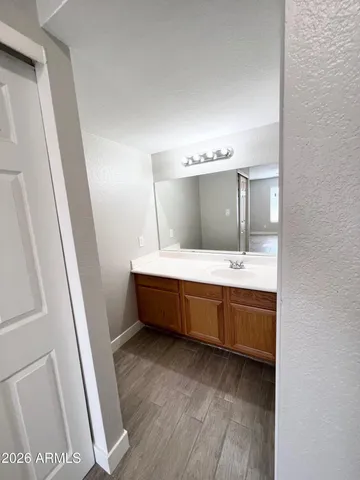 a white toilet sitting next to a bath tub