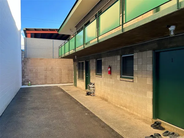 a front view of a house with parking area