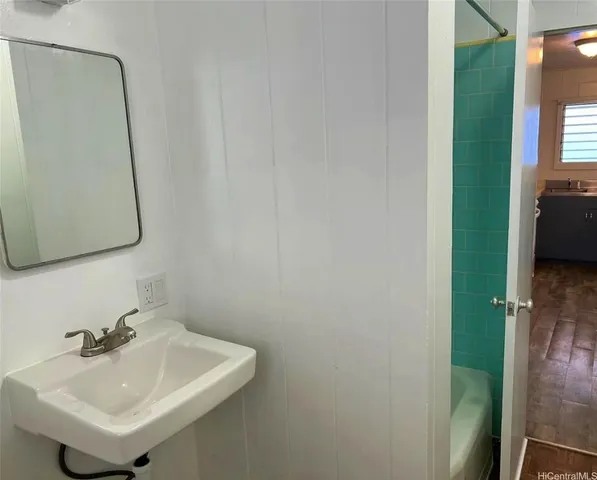 a bathroom with a sink and a mirror