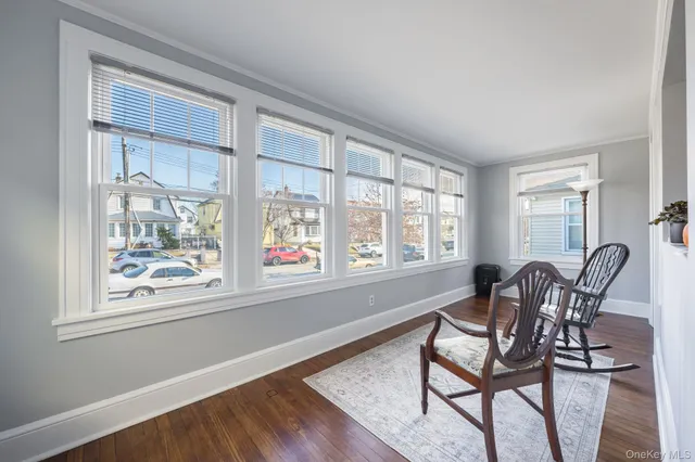 a dining room with furniture and windows