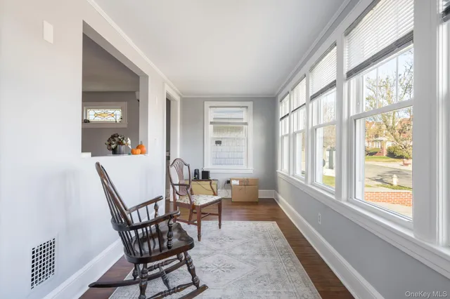 a dining room with furniture and windows