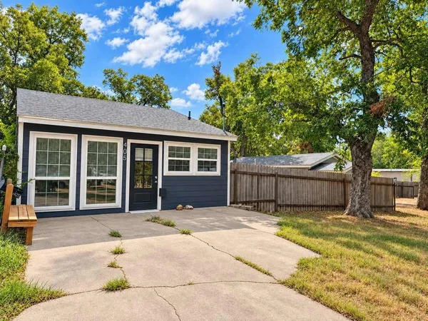 a house with trees in the background