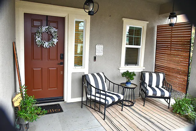 a view of a two chairs in the balcony