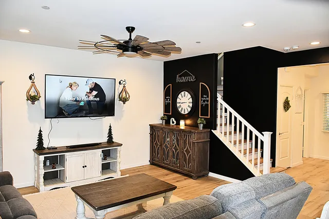 a living room with furniture and a flat screen tv