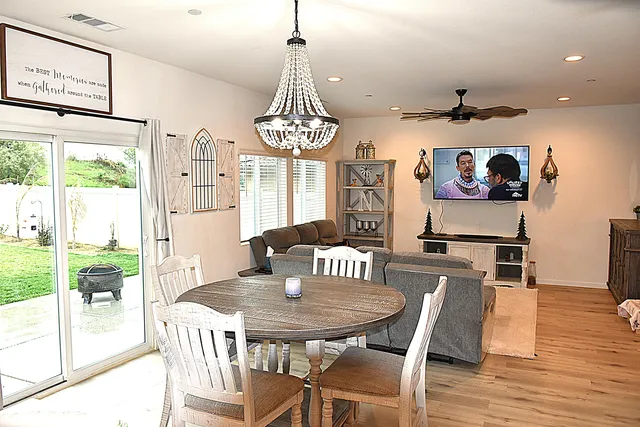 a view of a dining room with furniture window and wooden floor