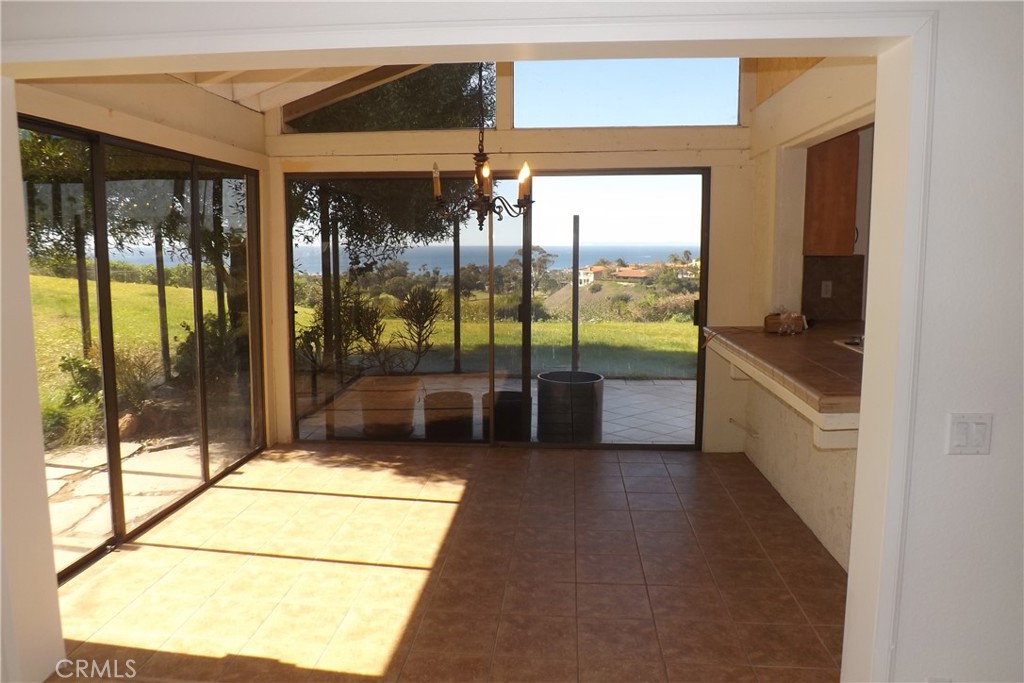 130 Avenida Adobe San Clemente, CA 92672 - Photo 11 of 26 a view of a glass door with a floor to ceiling window next to a yard